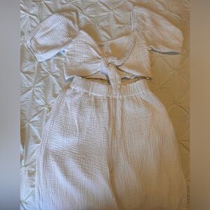 Long pants with matching white top.